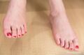 Bare feet painted toenails